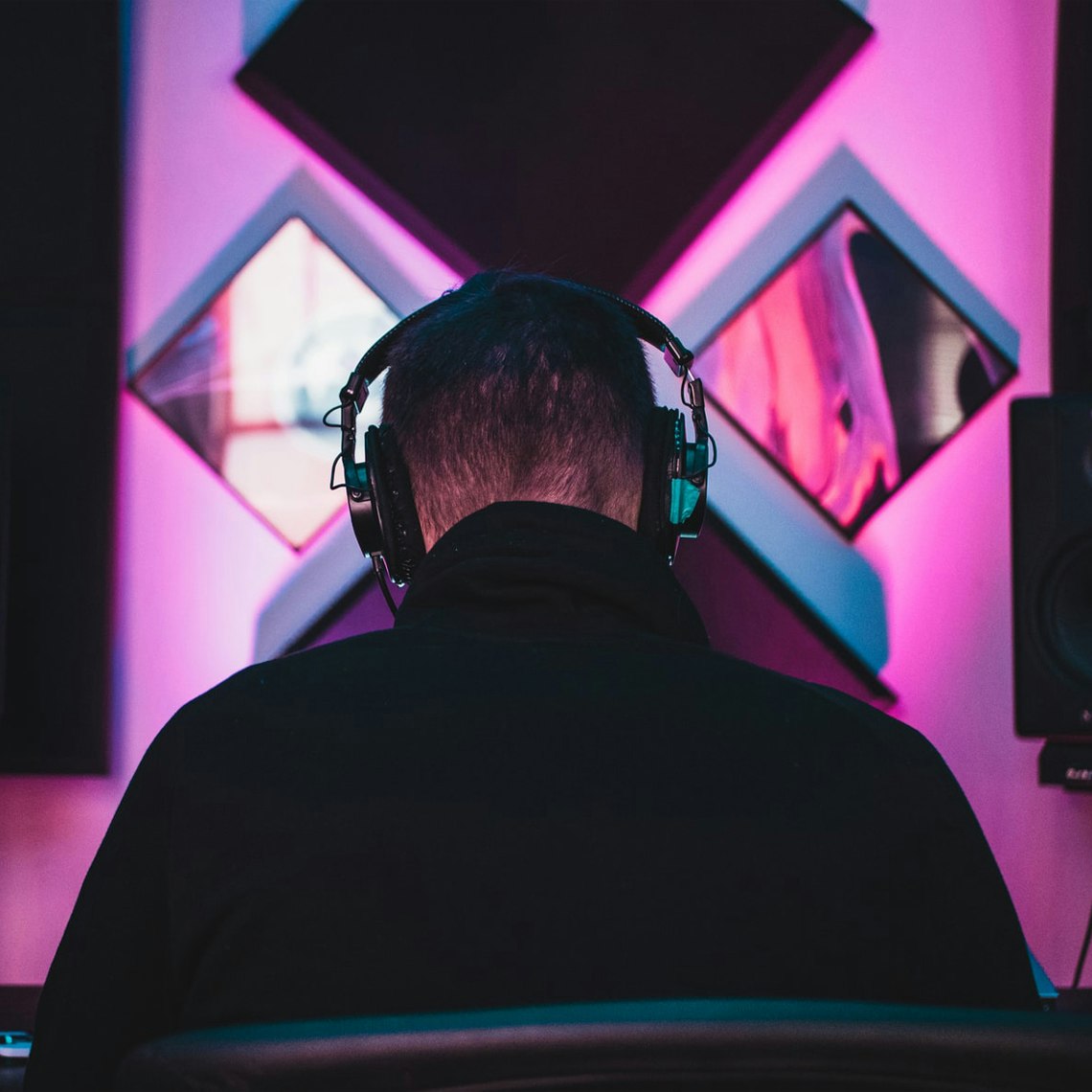 A producer in a studio working on music