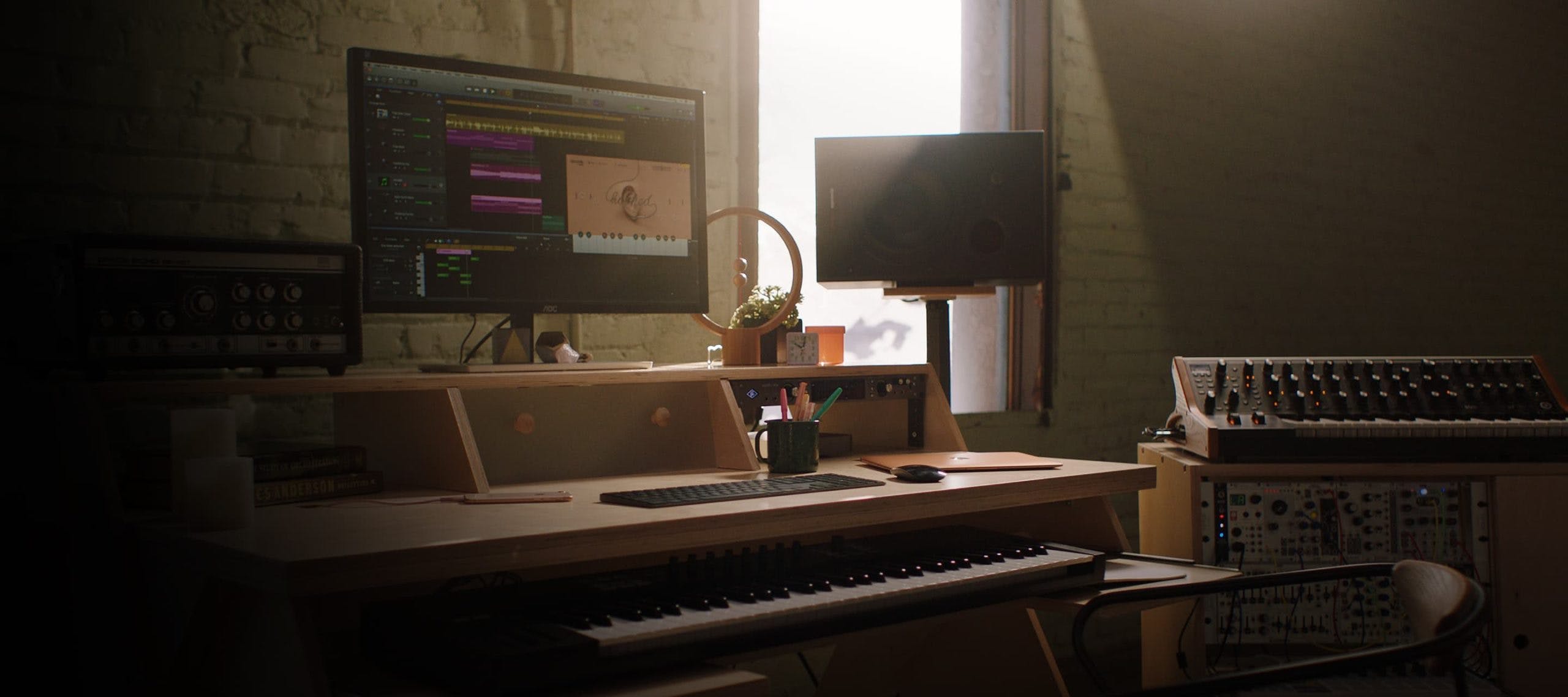 Studio setup with natural color Output Platform desk and natural color Output Sidecar accessory.